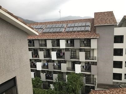 Solar thermal systems on the roof of building A, B, and C of the Second Student Dormitory on Zhiben campus that provide warm bath water year round. (Taitung University)